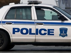 A Halifax Regional Police officer sits in a cruiser. - POSTMEDIA FILE