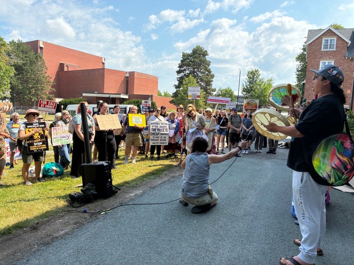 protesters peacefully rally outside of nova scotia premier tim houston's first stop on his state of the province tour at the annapolis valley chamber of commerce event in wolfville wednesday. it is unknown at this time who caused damage to the premier's vehicle during an altercation as some protesters attempted to prevent houston's vehicle from leaving the event site at acadia university.