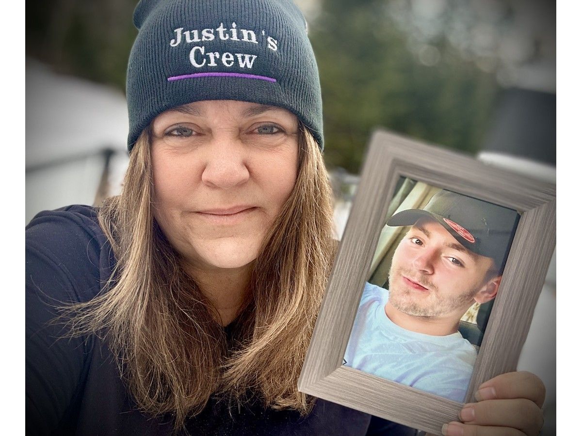Journalist and mother Tina Comeau holds a photo of her son Justin Surette who died in January 2024 after years of battling addiction. She now spreads addiction awareness. TINA COMEAU