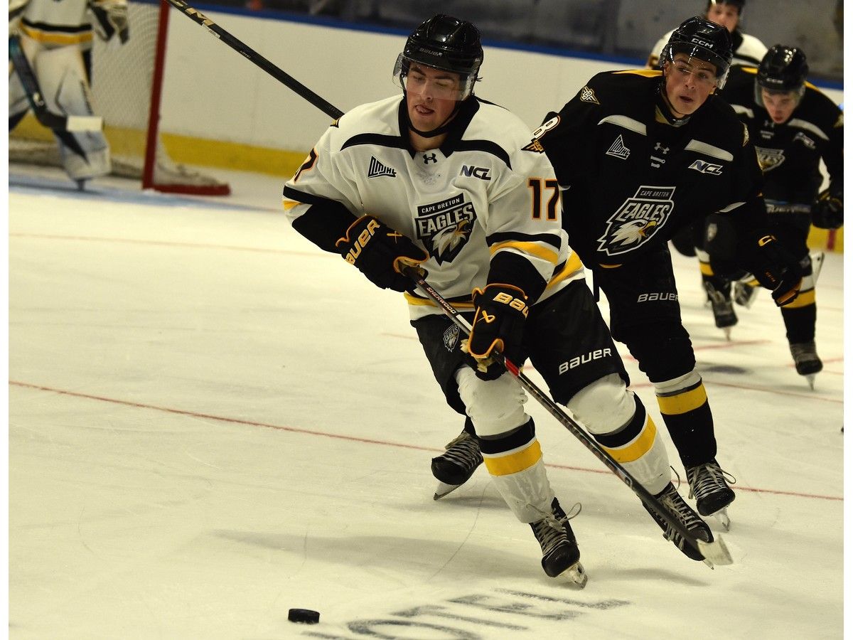 Evan Lyver, left, breaks out of his zone as he's chased by Benjamin Lebebvre during an intrasquad game at Cape Breton Eagles training camp at Centre 200 in Sydney on Thursday. JEREMY FRASER/CAPE BRETON POST