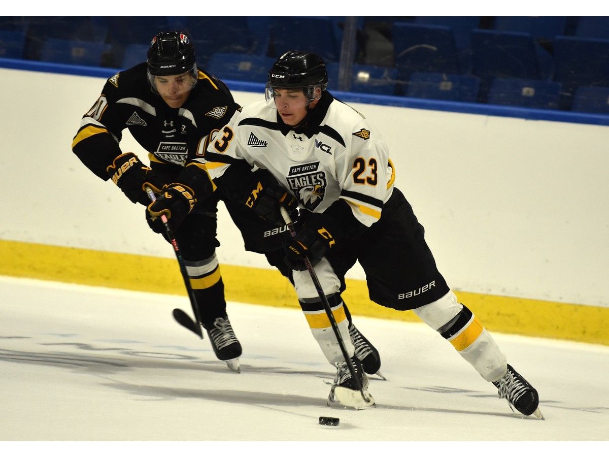 Andrew Migliore, right, carries the puck in the offensive zone as he's pressured by Nathan LeBlanc during an intrasquad game at Cape Breton Eagles training camp at Centre 200 in Sydney on Thursday. JEREMY FRASER/CAPE BRETON POST