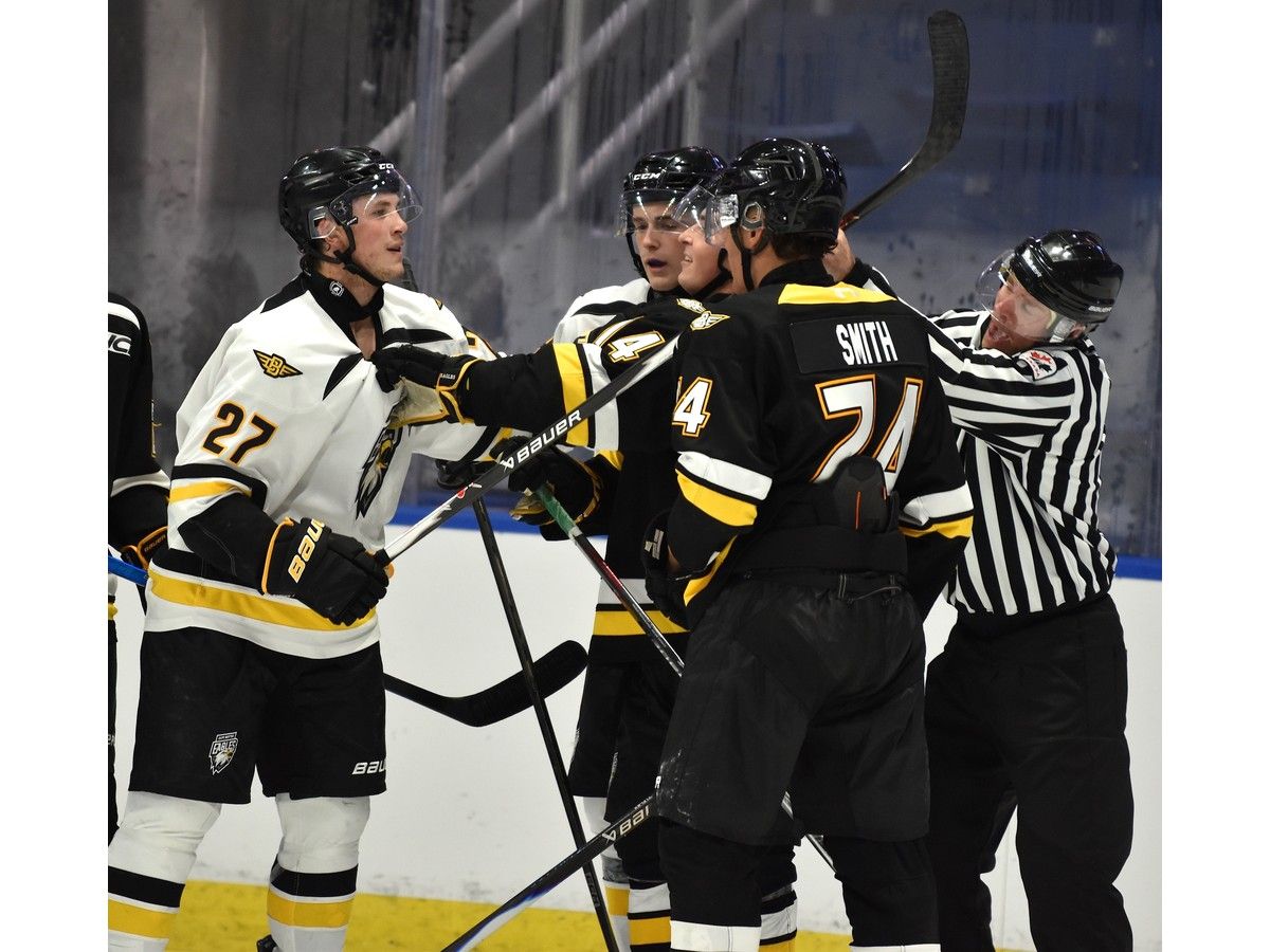 Drew Murphy, left, roughs it up with Tristan Richard and Gavin Smith during an intrasquad game at Cape Breton Eagles training camp at Centre 200 in Sydney on Thursday. JEREMY FRASER/CAPE BRETON POST