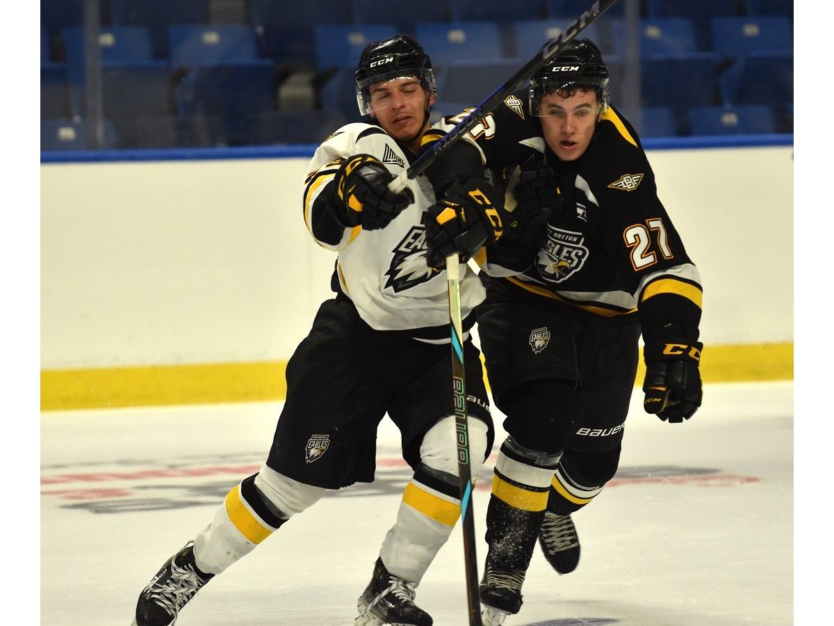 Andrew Migliore, left, and Gabriel Lopez-Courcy battle for position during an intrasquad game at Cape Breton Eagles training camp at Centre 200 in Sydney on Thursday. JEREMY FRASER/CAPE BRETON POST