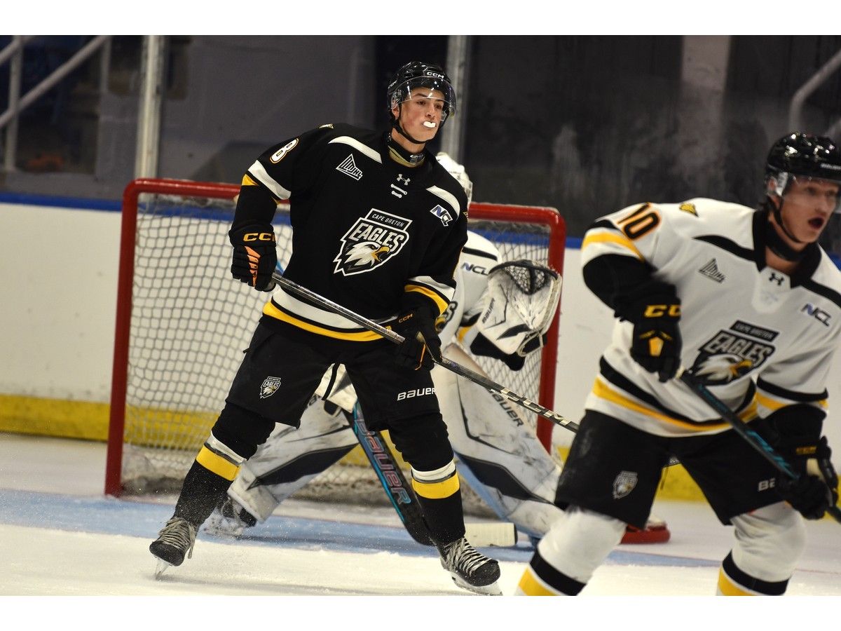 Benjamin Lefebvre, left, separates himself from the crowd in front of the net during an intrasquad game at Cape Breton Eagles training camp at Centre 200 in Sydney on Thursday. JEREMY FRASER/CAPE BRETON POST