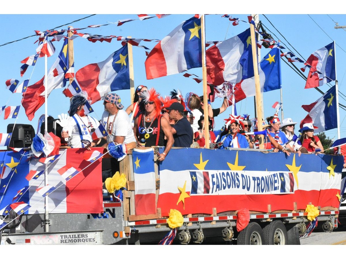 The sign on this colourful float in the Aug. 15 National Acadian Day Tintamarre as part of the Festival acadien de Clare encouraged people, in French, to 'Faisons de Tronne!', which translates to Let's Make Noise. The Acadians on the float celebrating their Acadian pride more than delivered on this. TINA COMEAU