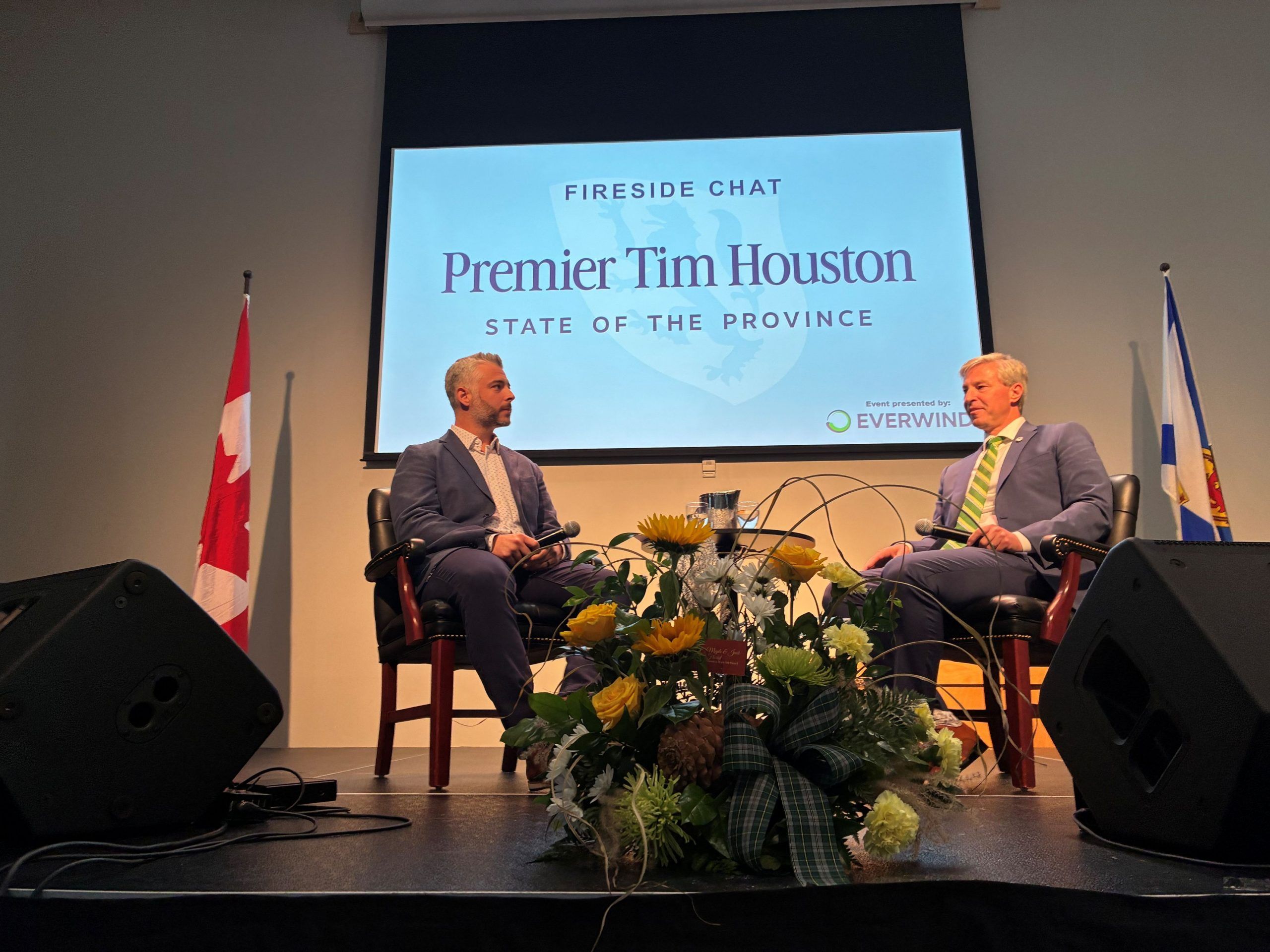 Premier Tim Houston speaks to Strait Area Chamber of Commerce President Jeremey Carroll at an event in Port Hawkesbury on Wednesday