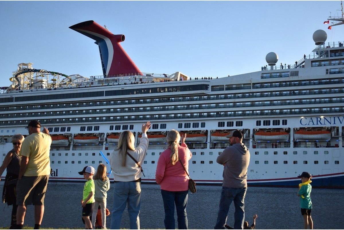 Waving goodbye.