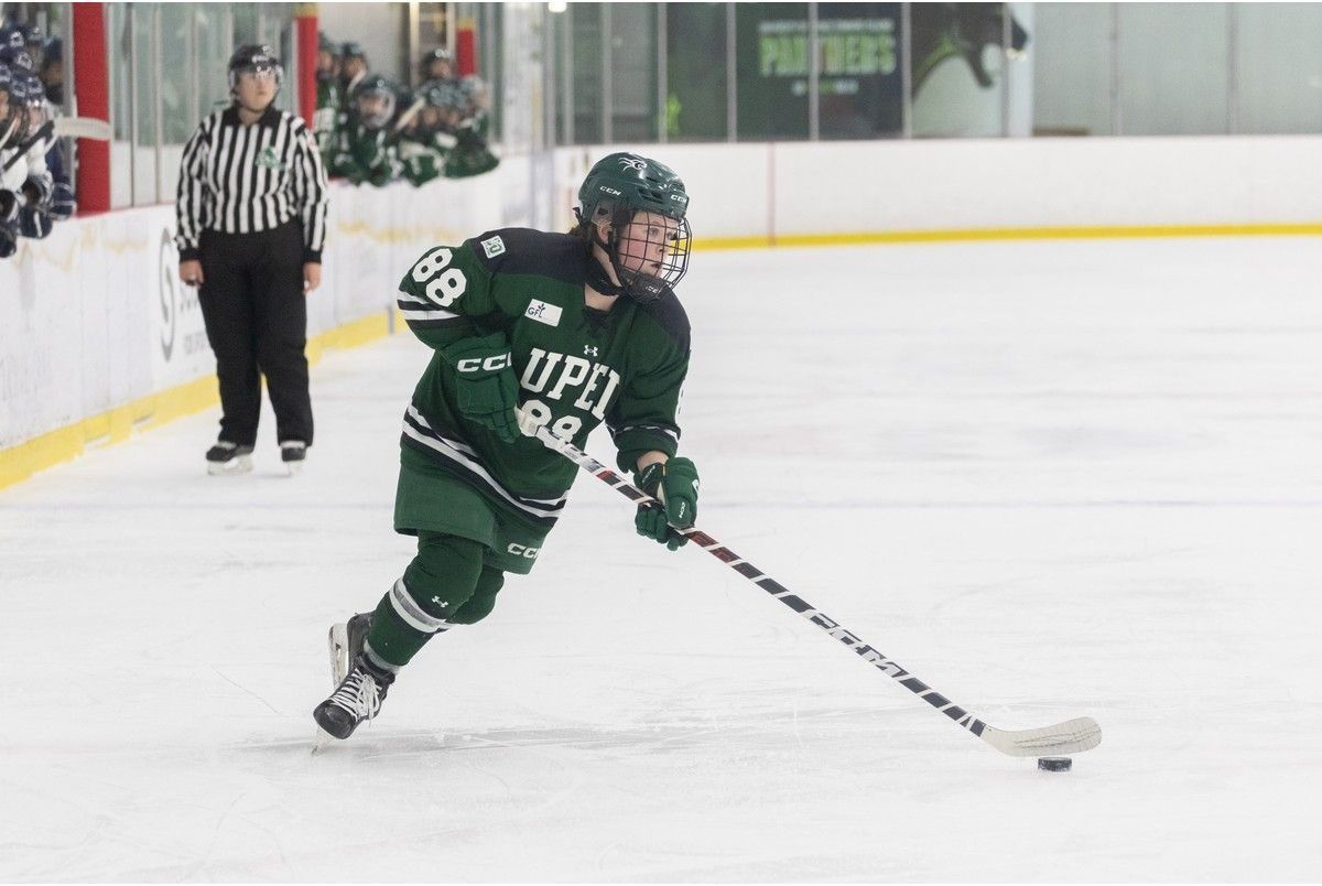 The UPEI Panthers’ Orianna MacNeil, 88, controls the puck in an AUS Women’s Hockey Conference game at MacLauchlan Arena in Charlottetown last season. The Mabou product will serve as an assistant captain for the 2026-27 season. Janessa Vanden Broek/UPEI Athletics