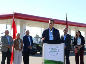 Rob Lantz speaks at a gas station