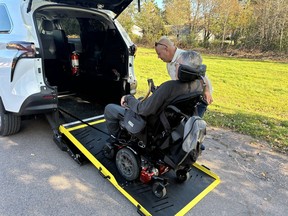 Jason Paulino, right, is one of the drivers for the new Cudmore's Accessible Cab, which is run by Pat and the Elephant. Dave Bell of Charlottetown, who is using the service, said the new on-demand accessible van is different than the normal Pat and the Elephant service in that the new taxi service services people on a first-come, first-served basis and does not have to be booked ahead of time. Dave Stewart