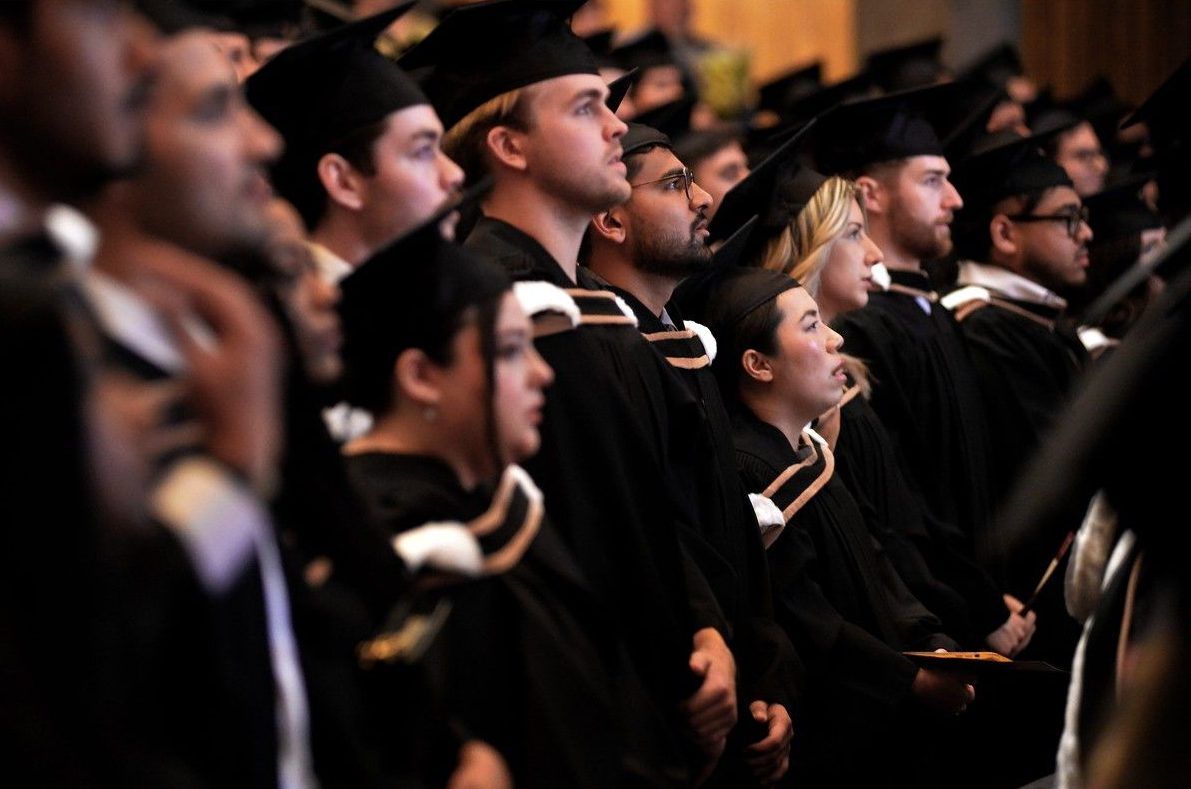 New graduates stand during the national anthem at the start Memorial University of Newfoundland and Labrador’s fall convocation session Thursday afternoon Oct. 15, 2026.