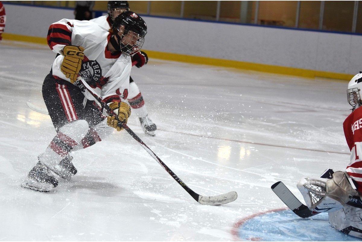 Matt Phillips of the Glace Bay Panthers, left, prepares to make a move on a breakaway during Cape Breton High School Hockey League action at Miners Forum in Glace Bay on Sunday night. Glace Bay won the game 6-3. JEREMY FRASER/CAPE BRETON POST