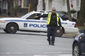 A Halifax Regional Police officer directs traffic at the scene of a natural gas leak on Oxford Street on May 12, 2021.