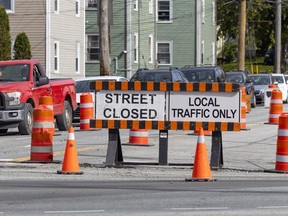 Motorists wait at the traffic lights at the intersection of Connaught Avenue and Bayers Road as road construction continues in the area on Wednesday, Oct. 21, 2026.