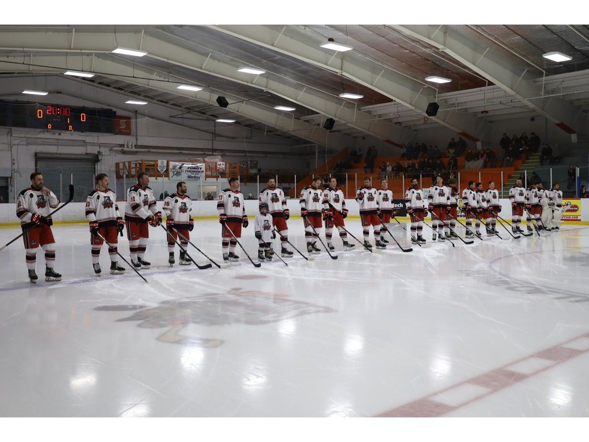 The Truro Mosaik Bearcats line up on their blue line during the opening ceremonies of their first home game of the 2026-27 season.