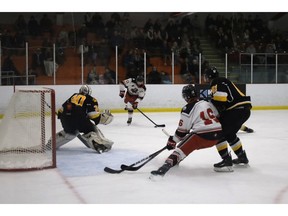 Truro Mosaik Bearcats captain Colin Campbell, middle, prepares to take a shot against Antigonish Bulldogs goalie Bryson Uberoi at the Colchester Legion Stadium. Campbell recorded a four-point game on Oct. 10, with three goals and one assist.