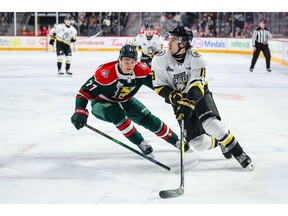 Eliot Litalien of the Cape Breton Eagles, right, works his way around Malik L'Italien of the Halifax Mooseheads during Quebec Maritimes Junior Hockey League action at Scotiabank Centre in Halifax on Friday. Cape Breton won the game 6-3. CONTRIBUTED/TREVOR MACMILLAN