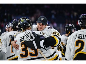 Sam Berthiaume shares a hug with goaltending partner Lucas Beckman after the Cape Breton Eagles 6-3 win over the Halifax Mooseheads in Quebec Maritimes Junior Hockey League action at Scotiabank Centre in Halifax on Friday. CONTRIBUTED/TREVOR MACMILLAN