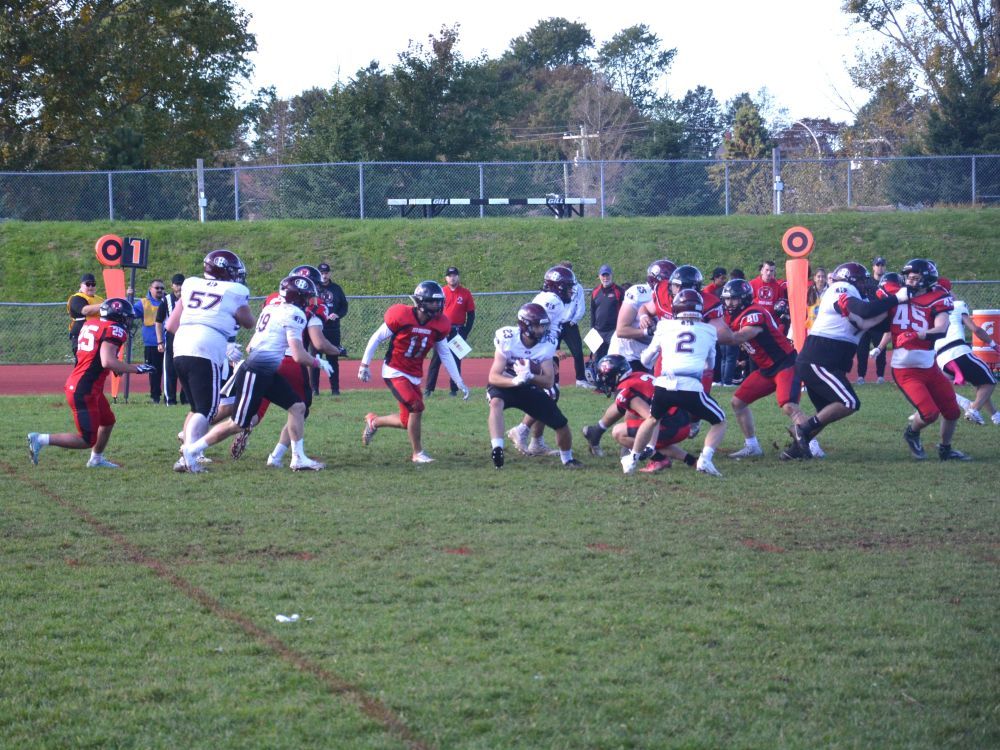 The Holland Hurricanes' Pierce Saunders, 23, of Hunter River, P.E.I., carries the ball in an Atlantic Football League regular-season game against the UNB Reds at MacAdam Field (UPEI Alumni Canada Games Place) in Charlottetown on Oct. 3. The Hurricanes will host the Reds in a semifinal game at MacAdam Field on Oct. 24 at 1 p.m. It will mark the Hurricanes' first home playoff game since 2017.