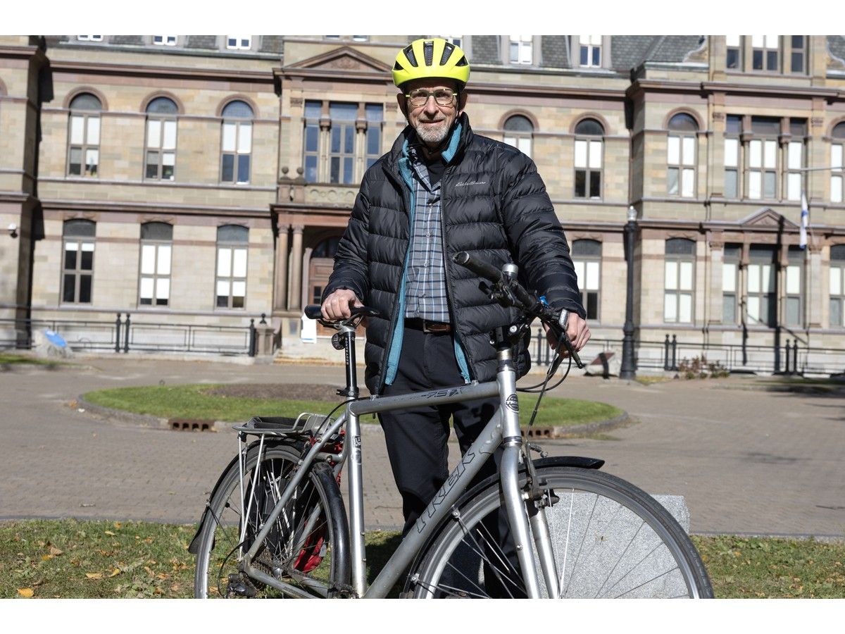 David Trueman, chair of the Halifax Cycling Coalition, poses for a photo in front of Halifax City Hall on Tuesday.