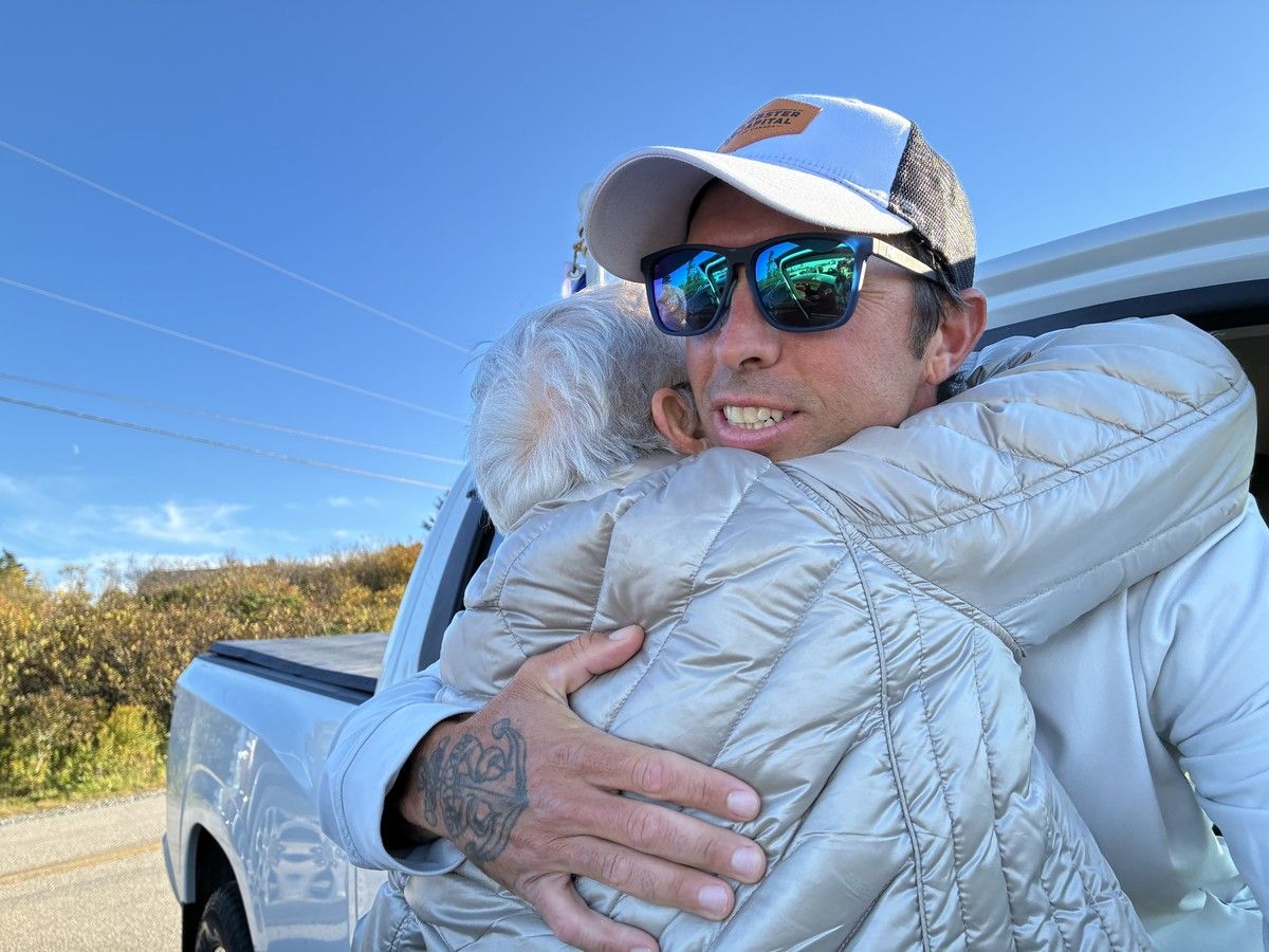 Landon Smith gets a hug from his aunt June Smith during a welcome home celebration from the community after completing his tip to tip run across Nova Scotia in support of Autism Nova Scotia. KATHY JOHNSON