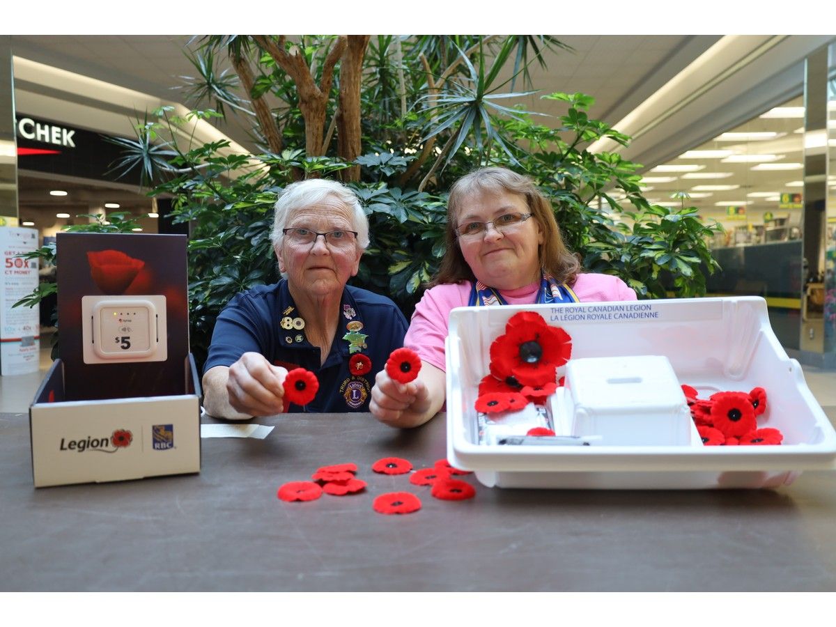 Vesta Brown, right, and her mom, Darlene Chaplin collect donations for the poppy campaign in The Hub Shopping Centre on Oct. 26. The Truro Legion is running its poppy campaign until Nov. 10.
