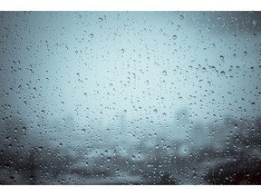 Rain drops on window glass outside texture background. Stock Photo/Getty Images