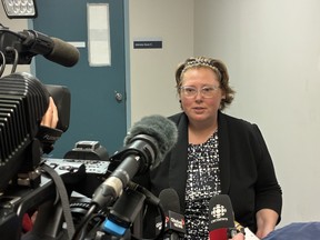 Federal Crown attorney Lee-Ann Conrod speaks with reporters Aug. 19 after Ali Assakereh's appearance in Halifax bail court on charges from a bomb threat against the local U.S. consulate. Assakereh now faces a total of five charges from the incident.