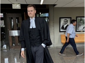 Defence lawyer Allan MacDonald approaches reporters at Nova Scotia Supreme Court in Halifax in July after a bail review for Eric David Thibault. The lobster dealer appeared in Digby provincial court for a bail hearing Monday after he was arrested last month on criminal harassment charges. Judge Angela Caseley ordered Thibault released on a $105,000 bail order with a curfew and electronic monitoring.