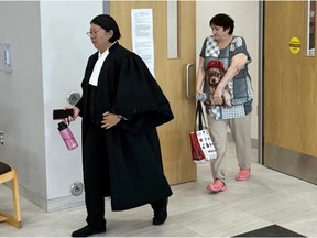 Mary Isabelle Mansfield, 69, of Calgary leaves Nova Scotia Supreme Court in Dartmouth with lawyer Carbo Kwan on Sept. 8 during a break at her trial on a historical charge of indecent assault.