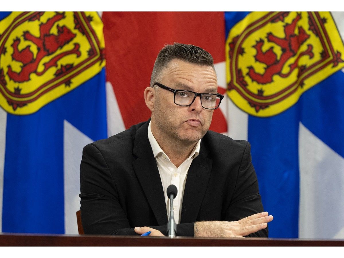 Education and early childhood development minister Brendan Maguire answers questions from reporters at One Government Place on Sept. 3.