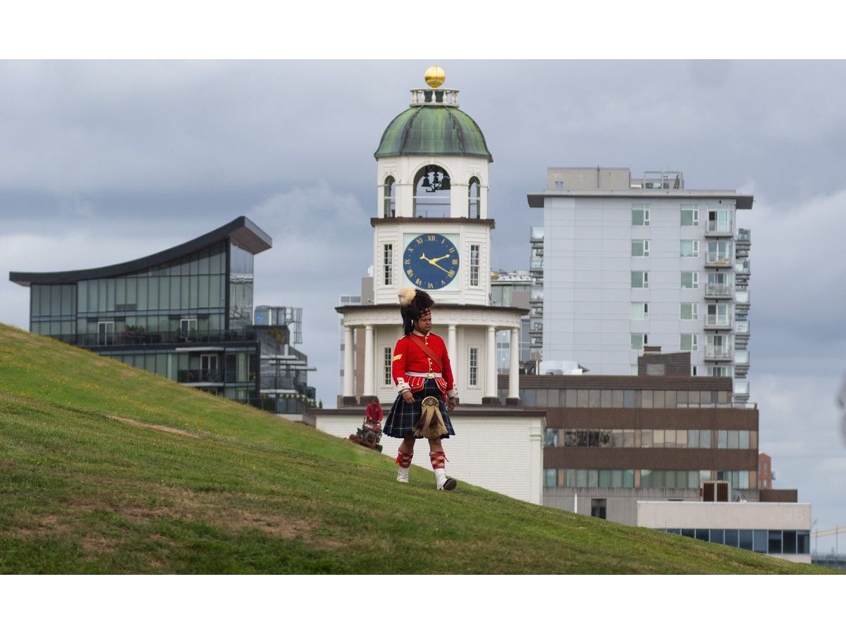 A 78th Highlander Regiment reenactor walks down Citadel Hill in front of the Old Town Clock on Wednesday, Sept. 25, 2024.