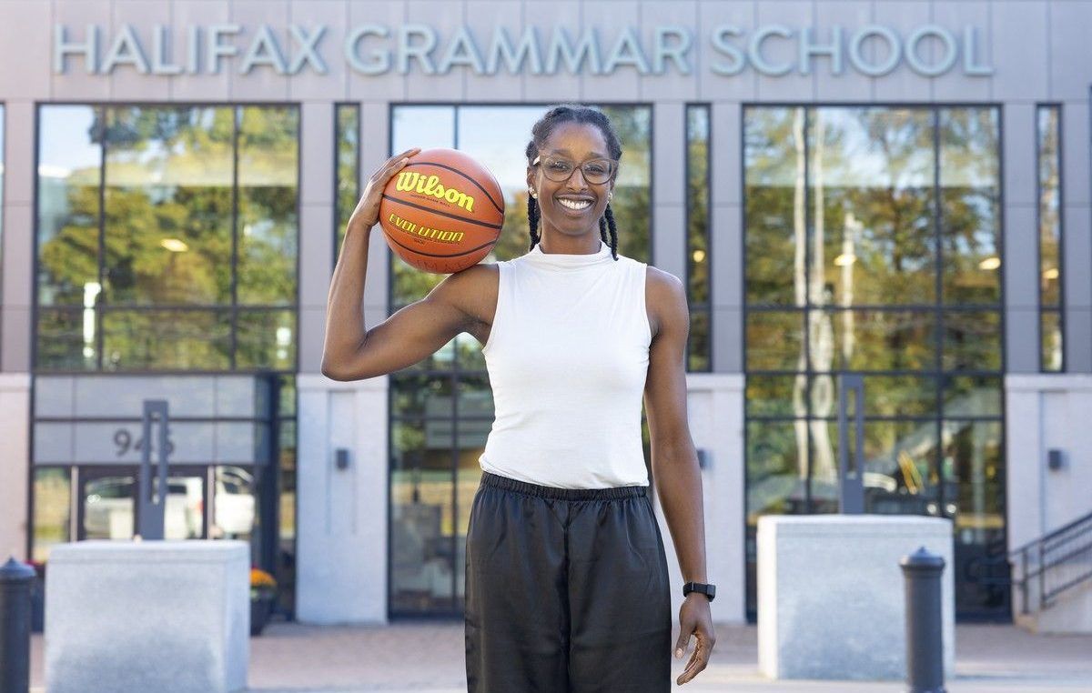 Justine Colley-Leger, athletic director at Halifax Grammar School and former basketball star at Saint Mary's University, poses for a photo outside the south-end Halifax school on Friday, Oct. 9.