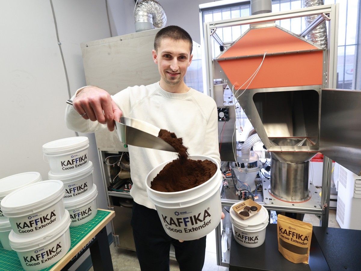 Quinn Cavanagh from the Nova Scotia company RFINE displays the consistency of their product, Kaffika, in their company's office in Dartmouth on Thursday. The company has developed a process that takes spent coffee grounds and turns them into an alternative for cocoa powder.