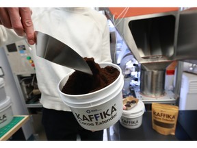 Quinn Cavanagh from the Nova Scotia company RFINE displays the consistency of their product, Kaffika, in their company's office in Dartmouth on Thursday. The company has developed a process that takes spent coffee grounds and turns them into an alternative for cocoa powder.
