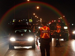 FILE - Windsor Police officers stop drivers on Ojibway Parkway near Windsor Raceway on Saturday August 14, 2010 during a RIDE program.