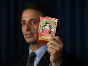 FILE: Kieth Kruskall with the Drug Enforcement Administration, holds up a package of synthetic marijuana at a news conference where it was announced that Federal and New York City authorities had broken up a group that trafficked in synthetic marijuana. /