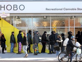 FILE: People line up outside the Hobo Recreational Cannabis Store on Bank Street April 1, the first day legal pot shops opened in Ottawa.