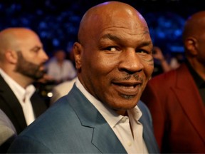 FILE: Former boxer Mike Tyson attends the super welterweight boxing match between Floyd Mayweather Jr. and Conor McGregor on Aug. 26, 2017 at T-Mobile Arena in Las Vegas, Nev. /