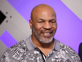 FILE: Mike Tyson speaks with Mario Lopez at Capital One Podcast Studio during the 2019 iHeartRadio Podcast Awards Presented by Capital One at the iHeartRadio Theater LA on Jan.\ 18, 2019 in Burbank, Calif. /