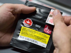 FILE: A warning label on ONE gram of cannabis is seen at Up's cannabis factory in Lincoln, Ontario.