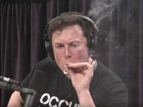 Elon Musk, pictured Sep. 7, 2018, smokes weed on "The Joe Rogan Experience" podcast.