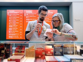 FILE: Employees at the Fire and Flower store prepare an order for a customer as the first legal cannabis stores open in the province of Ontario, in Ottawa, Ontario, Canada, Apr. 1, 2019. /