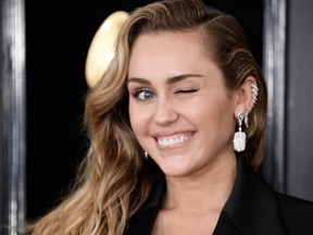 FILE: Singer Miley Cyrus arrives for the 61st Annual Grammy Awards on February 10, 2019, in Los Angeles (VALERIE MACON/AFP via Getty Images)