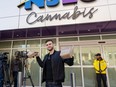 FILE: A resident holds up legally purchase cannabis products in Canada while exiting a Nova Scotia Liquor Corp. (NSLC) store in Halifax, N.S. on Wednesday, Oct. 17, 2018. /