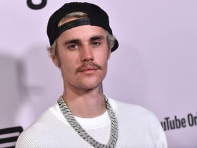 FILE: Canadian singer Justin Bieber arrives for YouTube Originals' "Justin Bieber: Seasons" premiere at the Regency Bruin Theatre in Los Angeles on January 27, 2020.