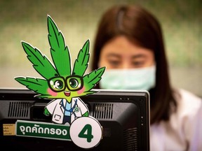 FILE: A nurse registers a patient during the opening of a cannabis (marijuana) clinic at the Department of Development of Thai Traditional and Alternative Medicine in Bangkok on Jan. 6, 2020. /