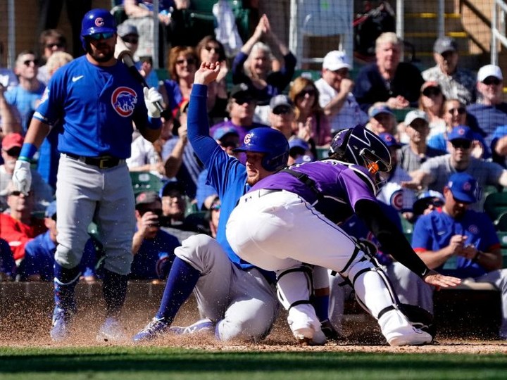  FILE: Chicago Cubs designated hitter Noel Cuervas scores a run against Colorado Rockies catcher Tony Wolters (14) during a spring training game at Salt River Fields at Talking Stick. / Photo: Rick Scuteri-USA TODAY Sports