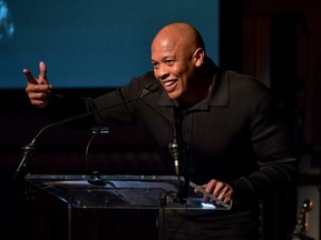 FILE: Dr. Dre speaks onstage during the Producers & Engineers Wing 13th annual GRAMMY week event honoring Dr. Dre at Village Studios on Jan. 22, 2020 in Los Angeles, Calif. /