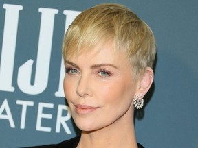 FILE: US-South African actress Charlize Theron arrives for the 25th Annual Critics’ Choice Awards at Barker Hangar Santa Monica airport on Jan. 12, 2020 in Santa Monica, Calif.